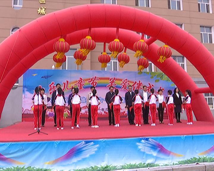 区委书记唐铁生看望慰问少年儿童